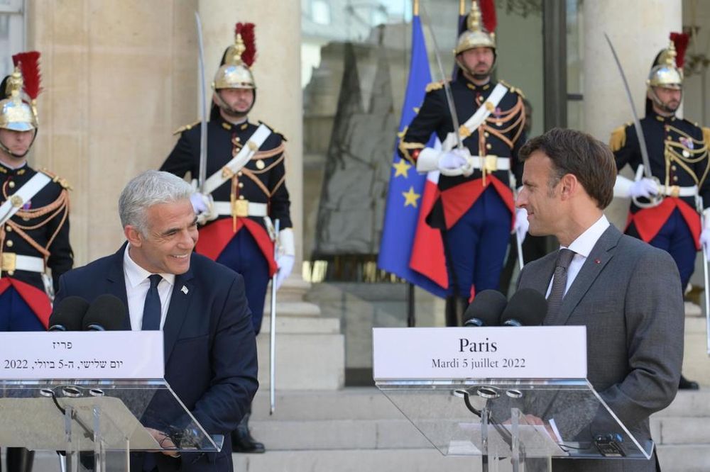 Israel's Prime Minister Yair Lapid (L) and his French counterpart Emmanuel Macron at the Elysee Palace in Paris, France, on July 5, 2022.