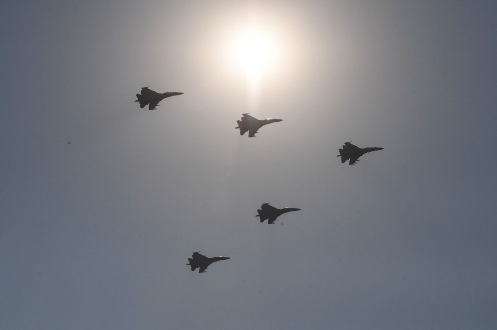 Chinese People's Liberation Army Air Force planes fly in formation during a military parade at Tiananmen Square in Beijing, China.
