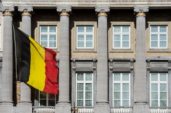 The Belgian flag flies outside the Belgian federal parliament in Brussels, Wednesday Feb. 12, 2014. Belgium