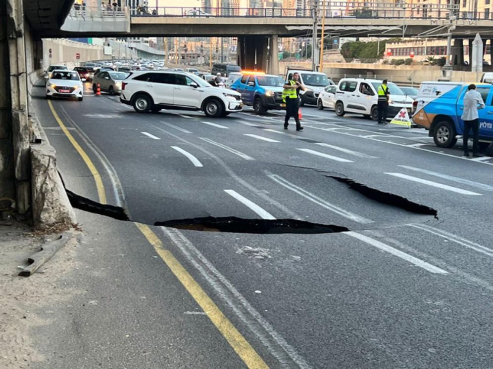 A gaping hole on the Ayalon Highway in Tel Aviv, Israel, September 17, 2022.