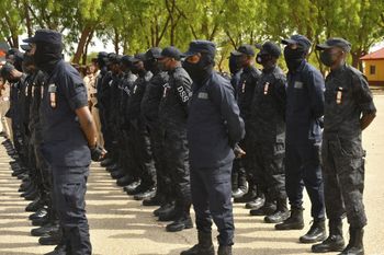 Department of State Security Services stand on parade during Nigerian President Muhammadu Buhari's visit to the Maimalari Barracks in Maiduguri on June 17, 2021.