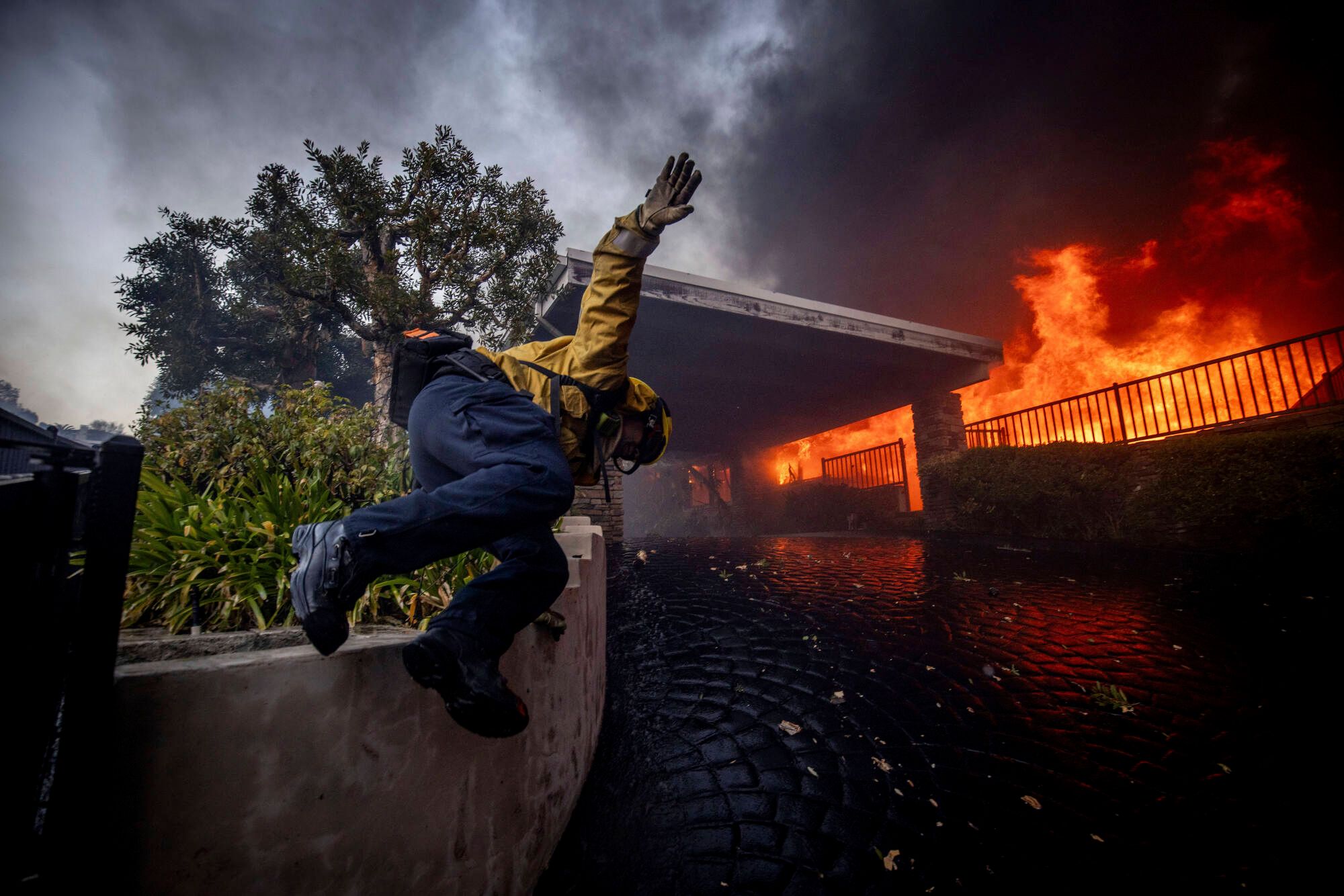 Tens Of Thousands Evacuated In LA As Massive Fires Spread Across City ...