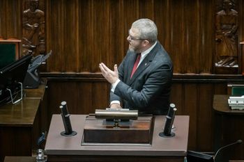 Far-right Polish MP Grzegorz Braun speaks in parliament after using a fire extinguisher to put out a Hanukkia placed in the parliament hall, in Warsaw, December 12, 2023.