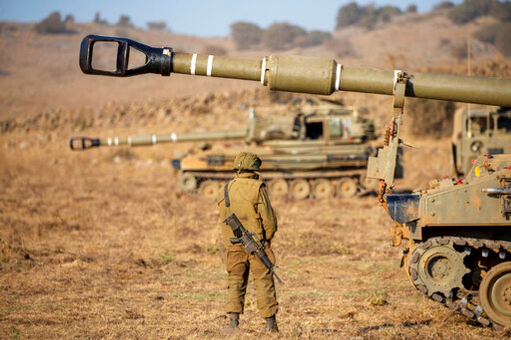 An Israeli soldier stands next to a mobile artillery unit during an exercise in the Golan Heights of northern Israel, August 4, 2020.
