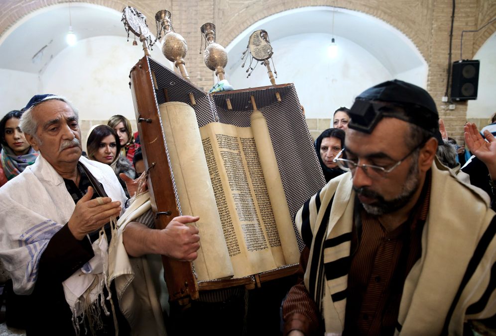 AP Photo/Ebrahim Noroozi In this Thursday, Nov. 20, 2014 photo, an Iranian Jewish man holds a Torah scroll at the Molla Agha Baba Synagogue, in the city of Yazd 420 miles (676 kilometers) south of capital Tehran, Iran.