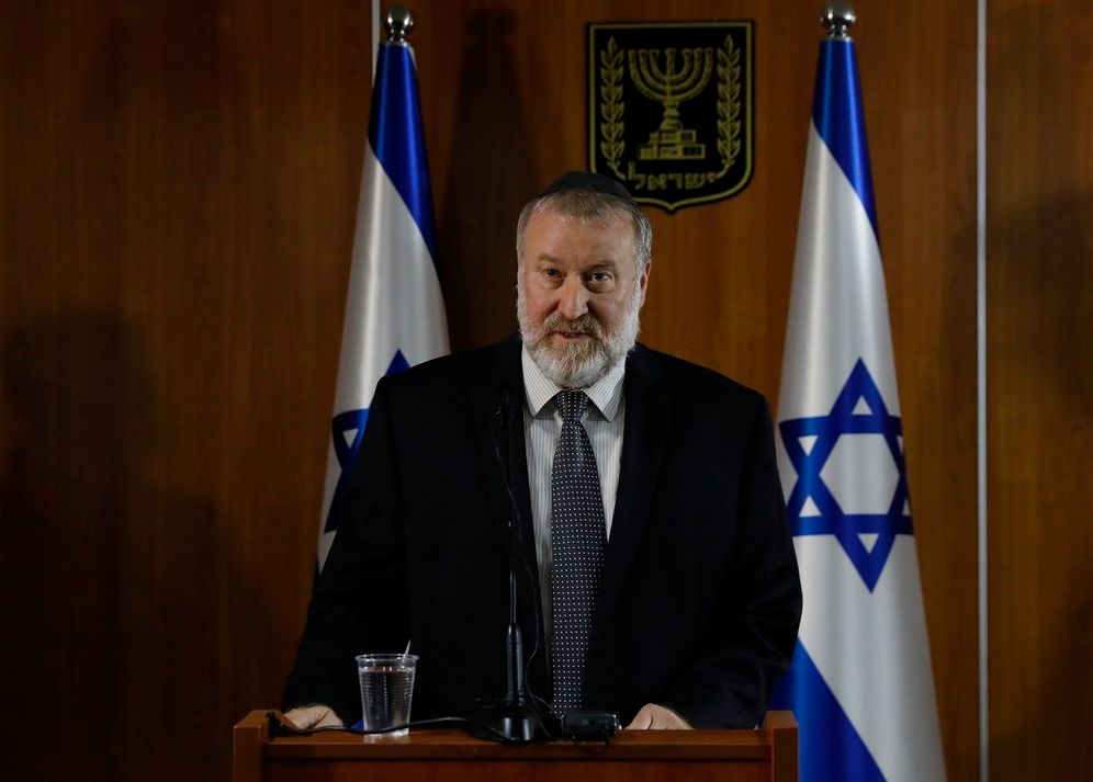 Israel's Attorney General Avichai Mandelblit reads statement for media in Jerusalem, Thursday, Nov. 21, 2019