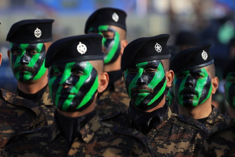 يشارك أفراد من قوات الأمن العراقية في فعالية بمناسبة يوم الشرطة العراقية في كلية الشرطة في بغداد، العراق، يوم الثلاثاء 9 يناير 2024.