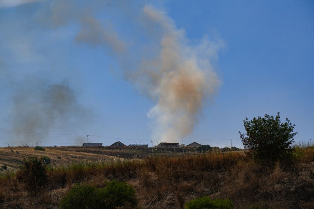 View of a large fire caused from rockets fired from Lebanon, outside Kibbutz Malkia, on the Israeli border with Lebanon, May 26, 2024.