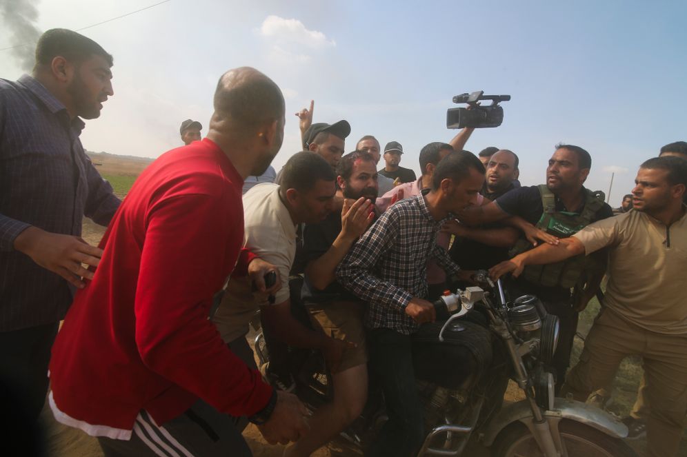 AP Photo Palestinians and Hamas militants transport Yarden Bibas to Gaza after kidnapping him from his home in Nir Oz, a kibbutz in Israel near the Gaza border, on Oct. 7, 2023