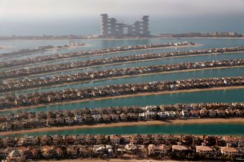 Villas on the fronds of the Jumeirah Palm Island are seen from the observation deck of The View at The Palm Jumeirah, in Dubai, United Arab Emirates.