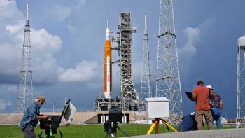 Photographers reset remote cameras near NASA's Artemis I moon rocket as it sits on Launch Pad 39-B at the Kennedy Space Center in Florida, the United States, on September 2, 2022.