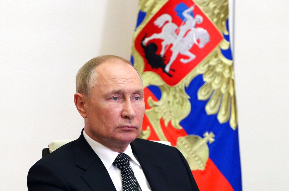 Russian President Vladimir Putin attends a meeting via a video conference link at the Novo-Ogaryovo state residence, outside Moscow, Russia