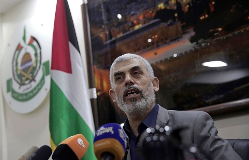 FILE - In this May 10, 2018 file photo, Yehiyeh Sinwar, the Hamas militant group's leader in the Gaza Strip, speaks to foreign correspondents, in his office in Gaza City