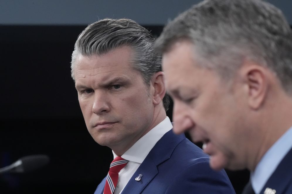 AP Secretary of War Pete Hegseth stands alongside US General Dan Caine at a Press Conference to discuss the war in Iran