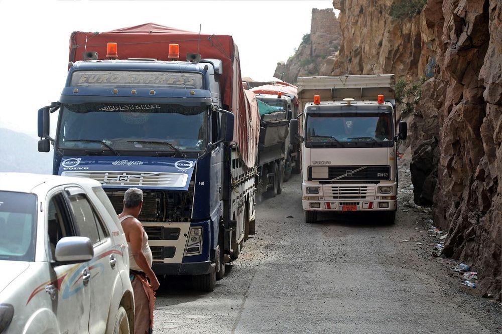Vehicles travel along a heavily damaged road in Taiz, Yemen, on September 23, 2020.