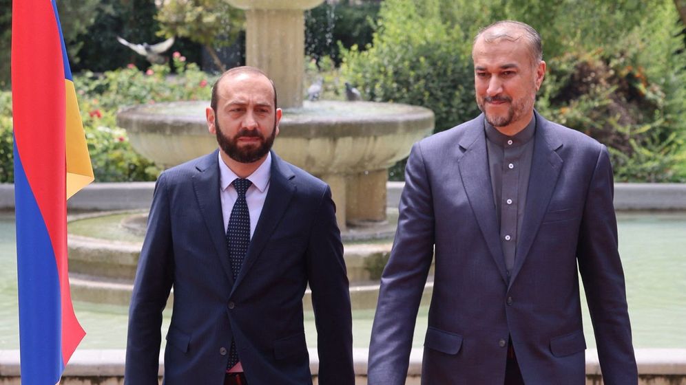Iran's Foreign Minister Hossein Amir-Abdollahian (R) poses for a picture with his counterpart from Armenia Ararat Mirzoyan in Tehran.