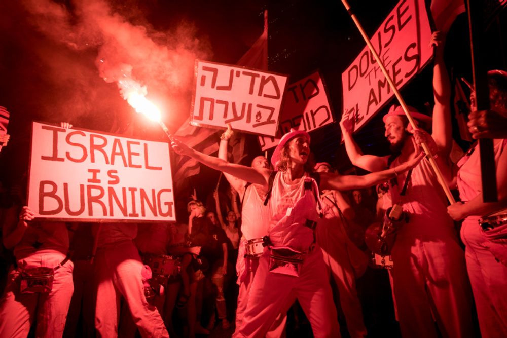 People protest against the planned judicial overhaul, in Tel Aviv, on June 24, 2023.