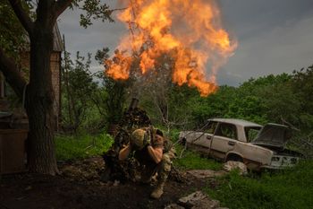A Ukrainian soldier fires a mortar at Russian positions on the frontline near Bakhmut, Donetsk region, Ukraine.