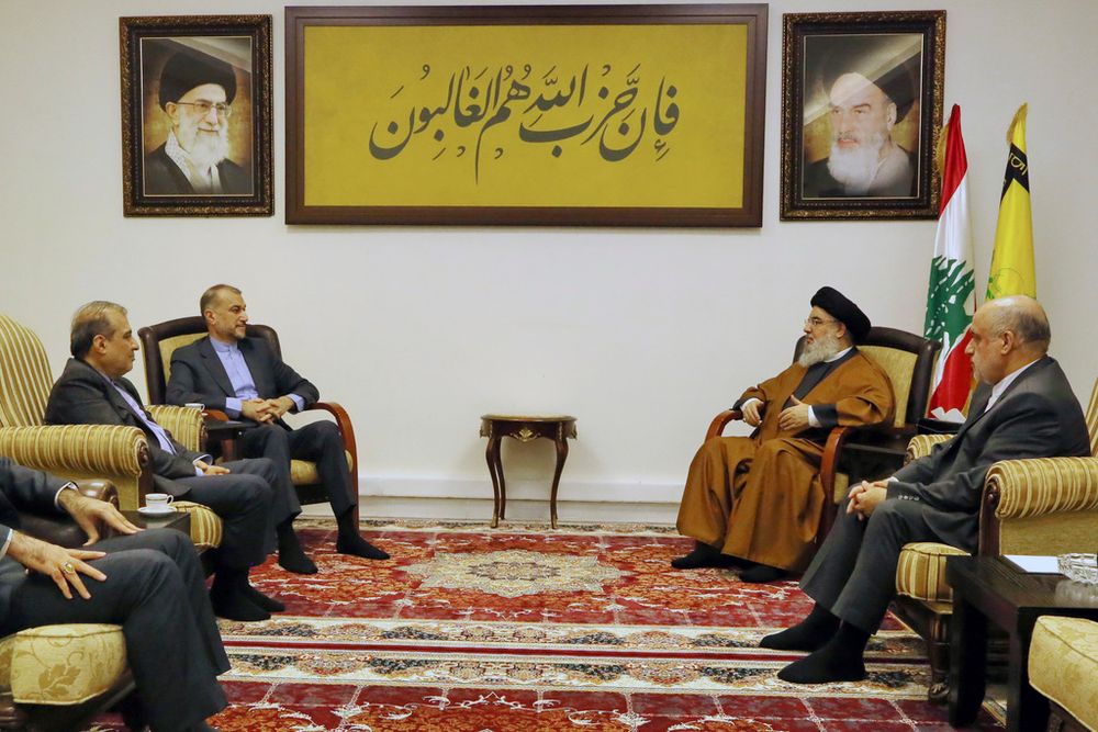 In this photoreleased by the Hezbollah Media Relations Office, Hezbollah leader Sayyed Hassan Nasrallah, second right, meets with Iranian Foreign Minister Hossein Amirabdollahian, second left, in Beirut, Lebanon.
