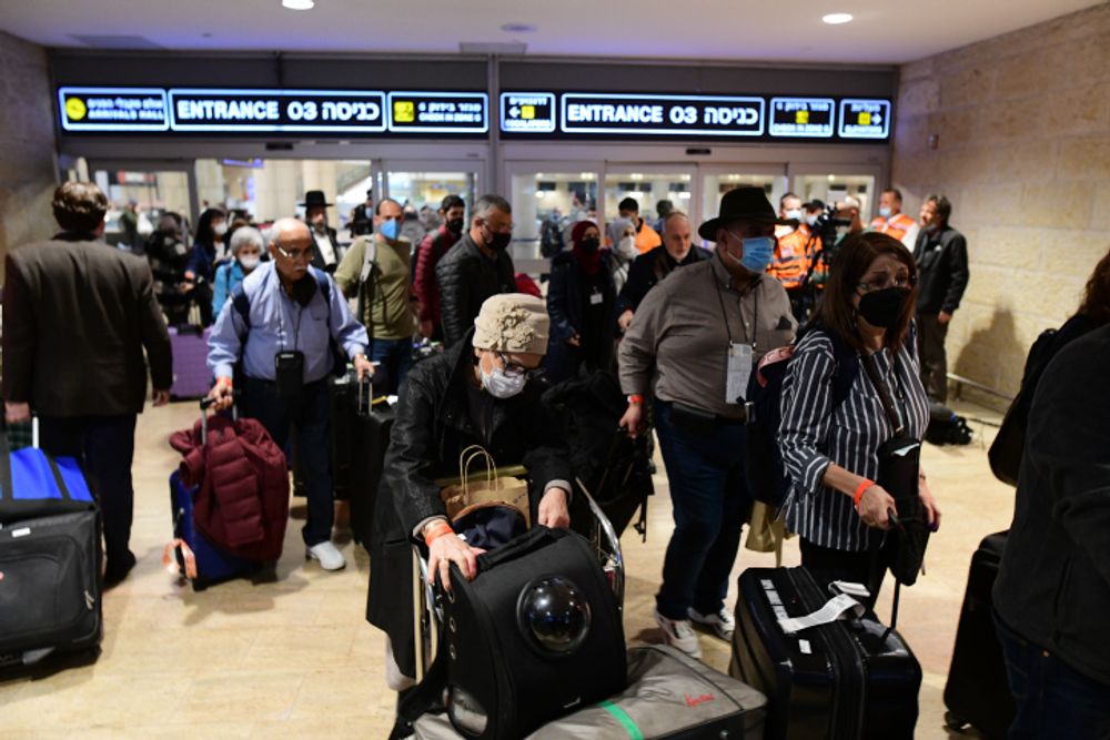 Israeli and Ukrainian refugees arriving from Ukraine on a relief flight are greeted at Ben Gurion International Airport near Tel Aviv, March 3, 2022.