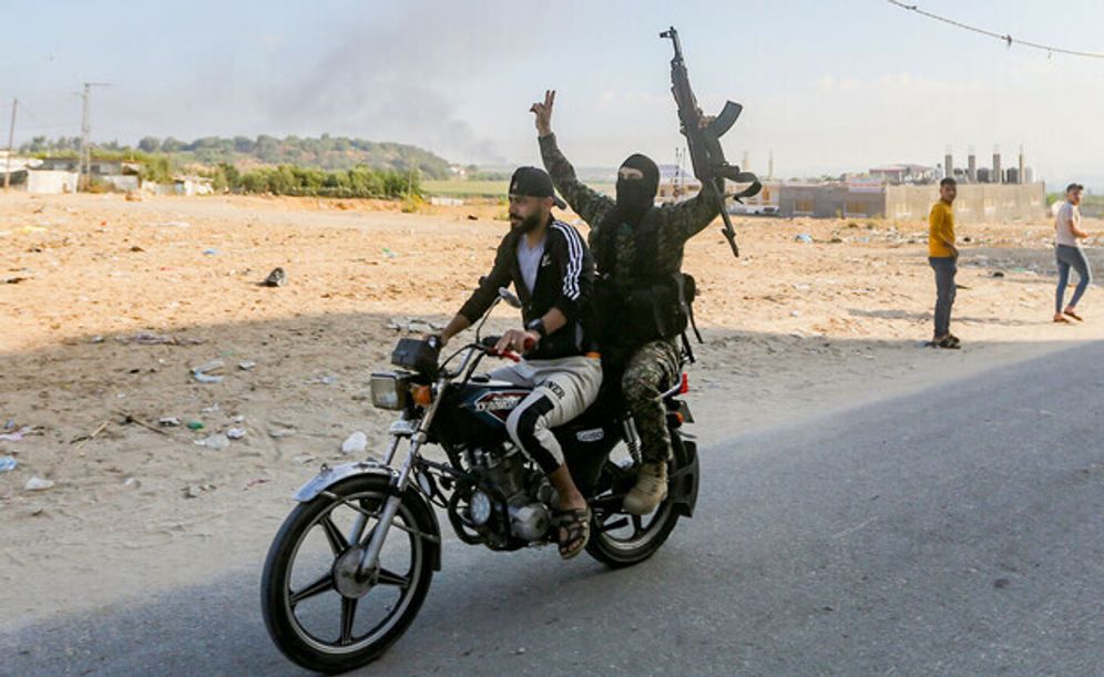Hamas terrorists entering Israel on a motorcycle on October 7
