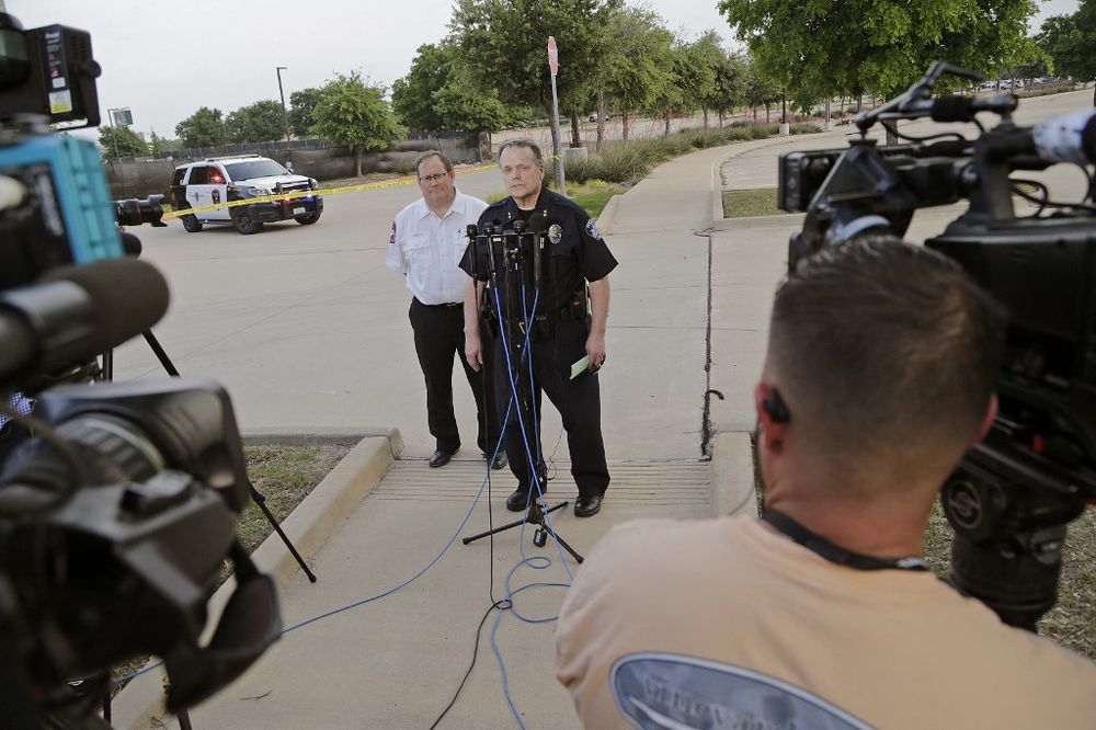 Officials deliver a statement to the press at the scene of a shooting in Allen, Texas, US.