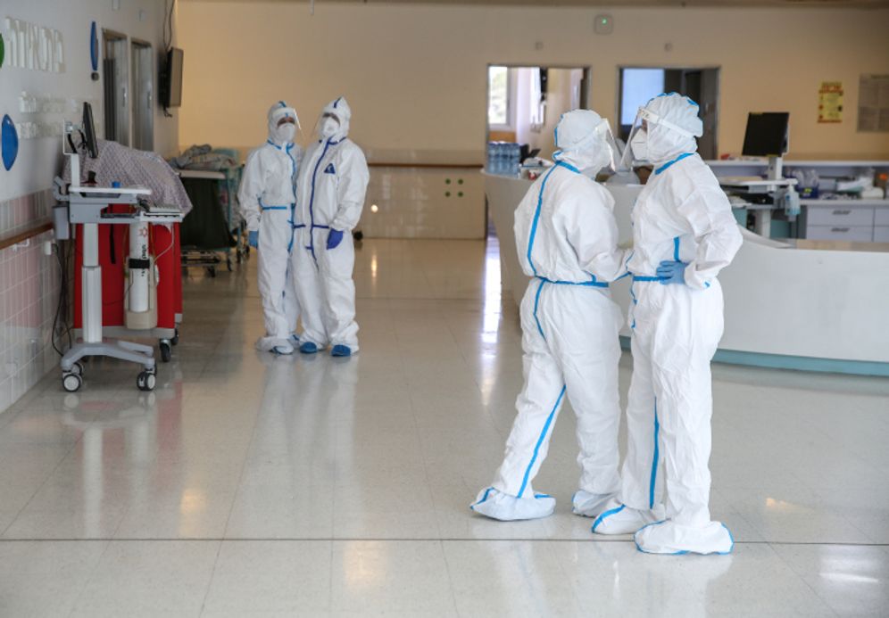 David Cohen/Flash90 Hospital personnel donning safety gear at the Coronavirus ward of the Ziv Medical Center in the northern Israeli city of Safed on February 04, 2021.