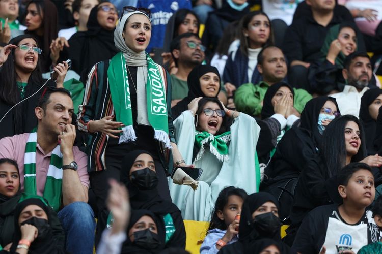 Saudi football fans react as they watch a live broadcast of the Qatar 2022 World Cup Group C football match between Poland and Saudi Arabia, in the Saudi capital of Riyadh.