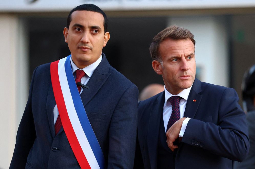 Reuters Pool Photo Credit Hannah McKay/Reuters Pool Photo via AP Emmanuel Macron et Ali Rabeh, le maire de Trappes