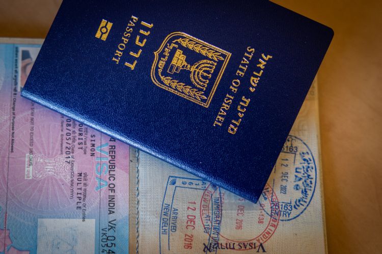 An illustration of a new Israeli passport and an old Israeli passport with a U.S. Visa in Jerusalem.