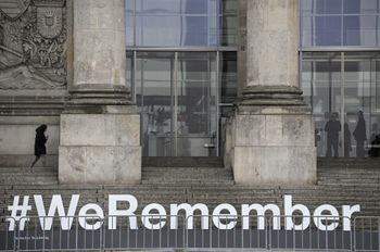 The lettering #WeRemember is seen on the stairs leading to the Reichstag building hosting the German lower House of parliament, the Bundestag, in Berlin as part of the ceremonies for the International Holocaust Remembrance Day held on January 27.
