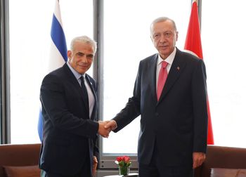 Turkey's President Recep Tayyip Erdogan (R) shakes hands with Israeli Prime Minister Yair Lapid during their meeting on the sidelines of the United Nations General Assembly in New York, the United States, on September 20, 2022.