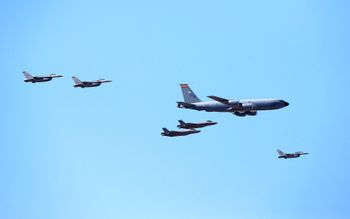 FILE - US fighter jets from the 56th Fighter Wing and the 944th Fighter Wing from Luke Air Force Base, along with a jet from the Arizona Air National Guard 161st Air Refueling Wing, fly over Phoenix, on May 1, 2020.
