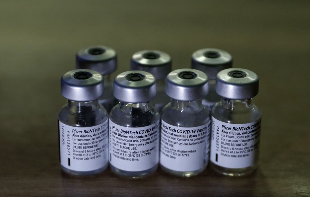 Empty Pfizer-BioNTech COVID-19 vaccine vials are pictured during a vaccination drive by Israel's Magen David Adom medical services at the Shuafat Palestinian refugee camp checkpoint in east Jerusalem, on March 17, 2021.