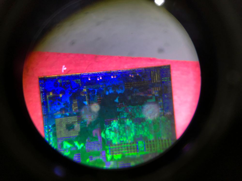 FILE - A microchip seen through a microscope.