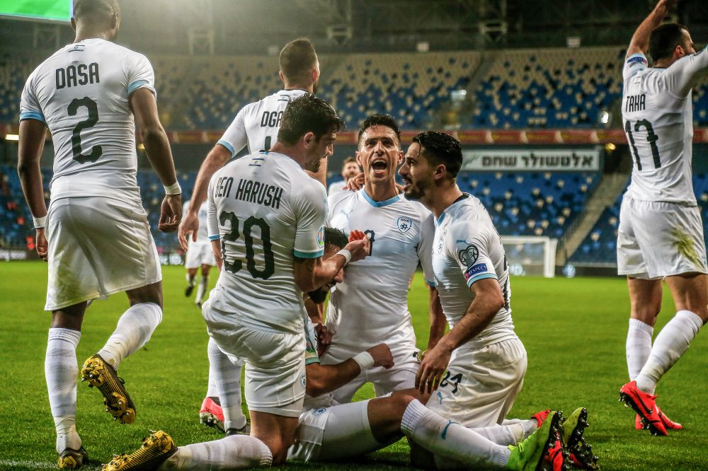 Israeli national team players celebrate a goal during the Euro 2020 qualifying soccer match at the Sammy Ofer Stadium, in Haifa, Israel, on March 24, 2019