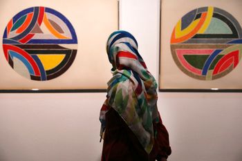 A visitor looks at artworks of the American artist Frank Stella, 'Sinjerli Variations No. 1-5- 1977,' at the Tehran Museum of Contemporary Art in Tehran, Iran, on August 2, 2022.