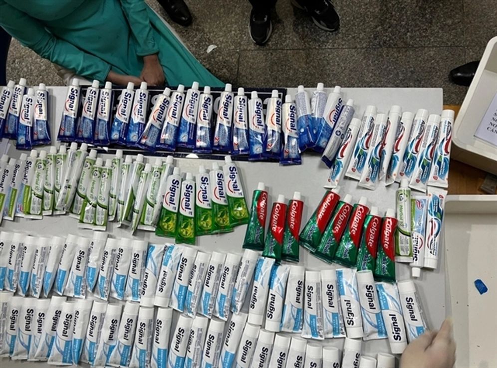 Drugs concealed in toothpaste tubes are seen in luggage carried by flight attendants in the case