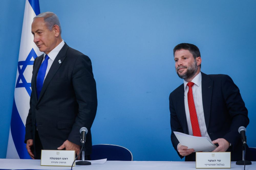 Israel's Prime Minister Benjamin Netanyahu (L) with Finance Minister Bezalel Smotrich.