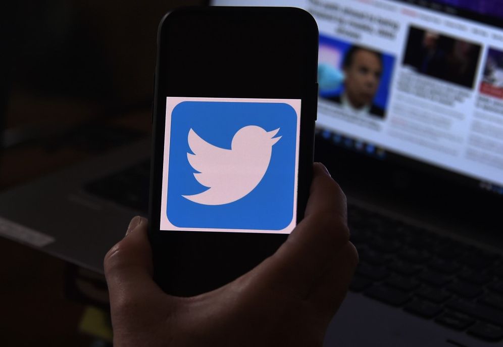A Twitter logo is displayed on a mobile phone on May 27, 2020, in Arlington, Virginia.