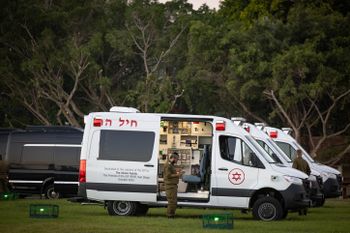 Israeli soldiers wait for the arrival of Israeli hostages at the Schneider Children's Medical Center in Petah Tikva.