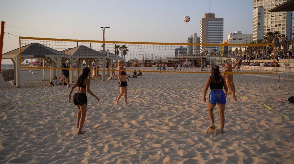 Israelis play footvolley on the beach in Tel Aviv, Israel.