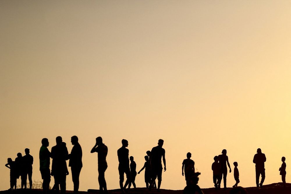 Palestinians gather on a beach in Beit Lahia in the northern Gaza Strip, on June 10, 2022.
