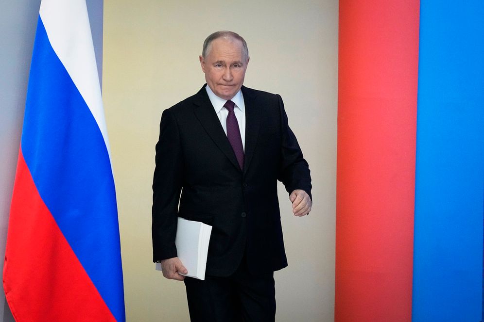 Russian President Vladimir Putin enters a hall to deliver his state-of-the-nation address in Moscow, Russia.