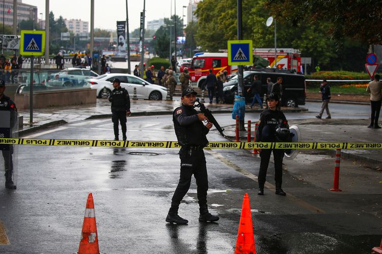 Turkish policemen and security forces cordon off an area after an explosion in Ankara, Turkey. (AP Photo/Ali Unal)