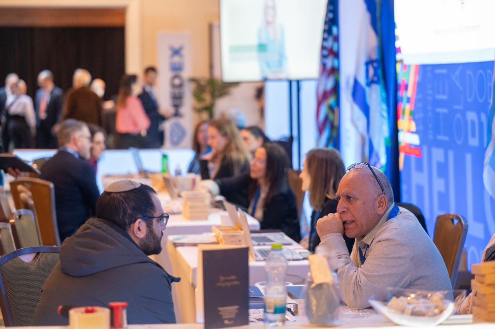 Doctors and medical professionals considering immigrating to Israel speak to representatives at the MedEx fair, held in Teaneck, New Jersey 