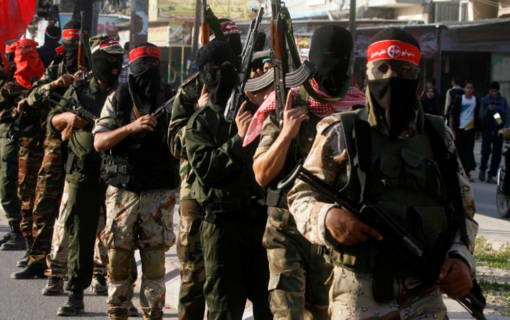 Palestinian terrorists from the Popular Front for the Liberation of Palestine (PFLP) take part in a military demonstration in Gaza.
