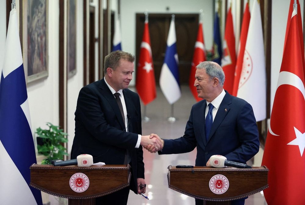 Turkish Defense Minister Hulusi Akar (R) shakes hand with his Finnish counterpart Antti Kaikkonen (L) during a joint press conference at Turkey's National Defense Ministry in Ankara.