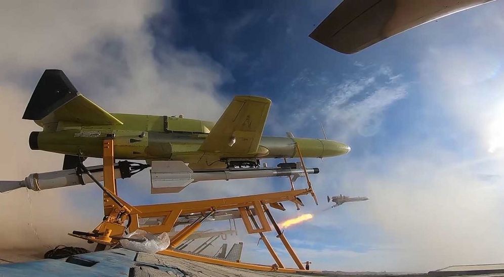 The launch of a drone carrying a missile during a military drill at an undisclosed location in central Iran, image released on January 6, 2021.