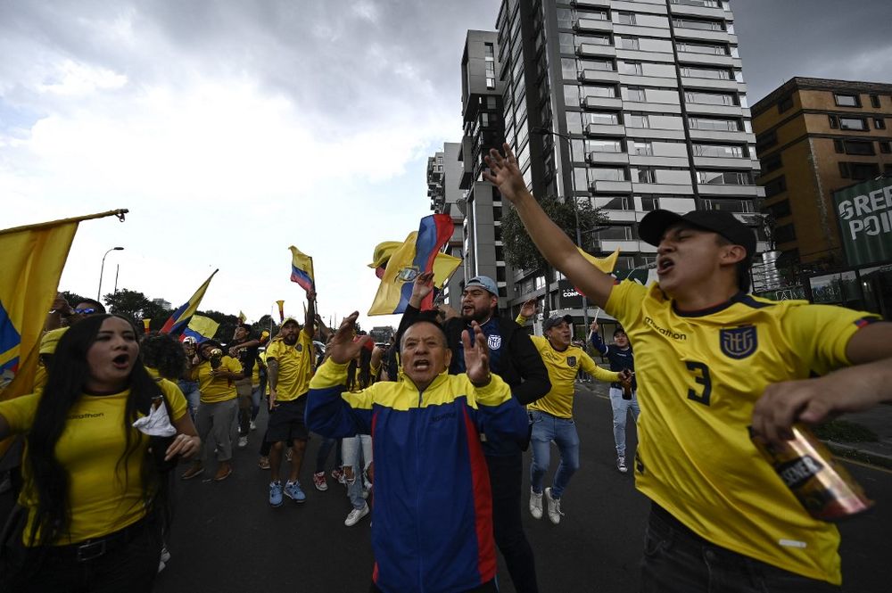 Football fans of Ecuador celebrate in the street after defeating Qatar in the opening football match of the Qatar 2022 World Cup in Quito, Ecuador, on November 20, 2022.